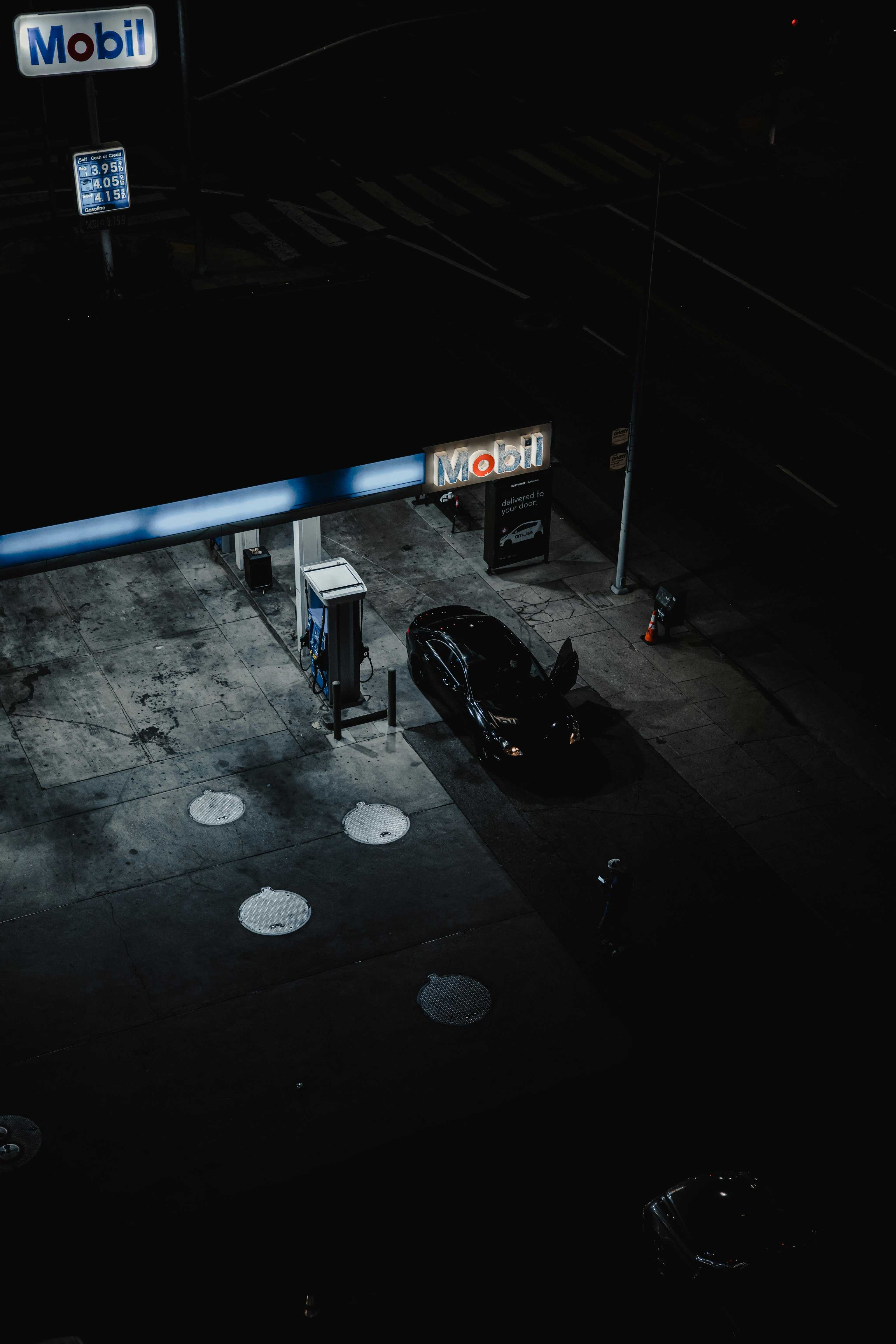 black car on parking lot during night time